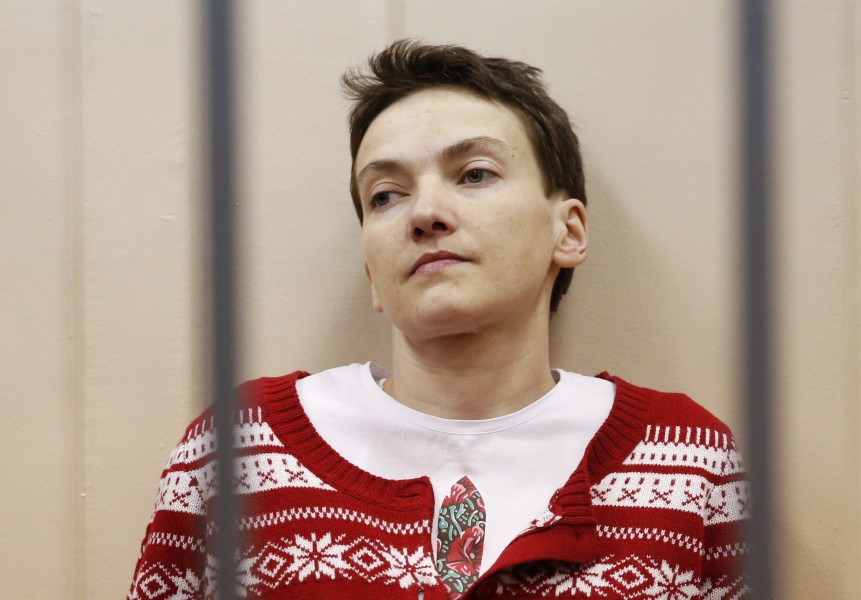 Ukrainian military pilot Nadezhda Savchenko looks out from a defendants' cage as she attends a court hearing in Moscow March 4, 2015. Savchenko, 33, was captured by pro-Russian forces and handed over eight months ago to Russia, where she was imprisoned on charges of aiding the killing of two Russian journalists in east Ukraine. At home, she has become a symbol of resistance to Russian aggression. REUTERS/Maxim Zmeyev (RUSSIA - Tags: POLITICS CIVIL UNREST CRIME LAW CONFLICT MILITARY)